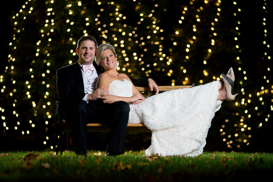 twinkling lights bride and groom wedding backdrop