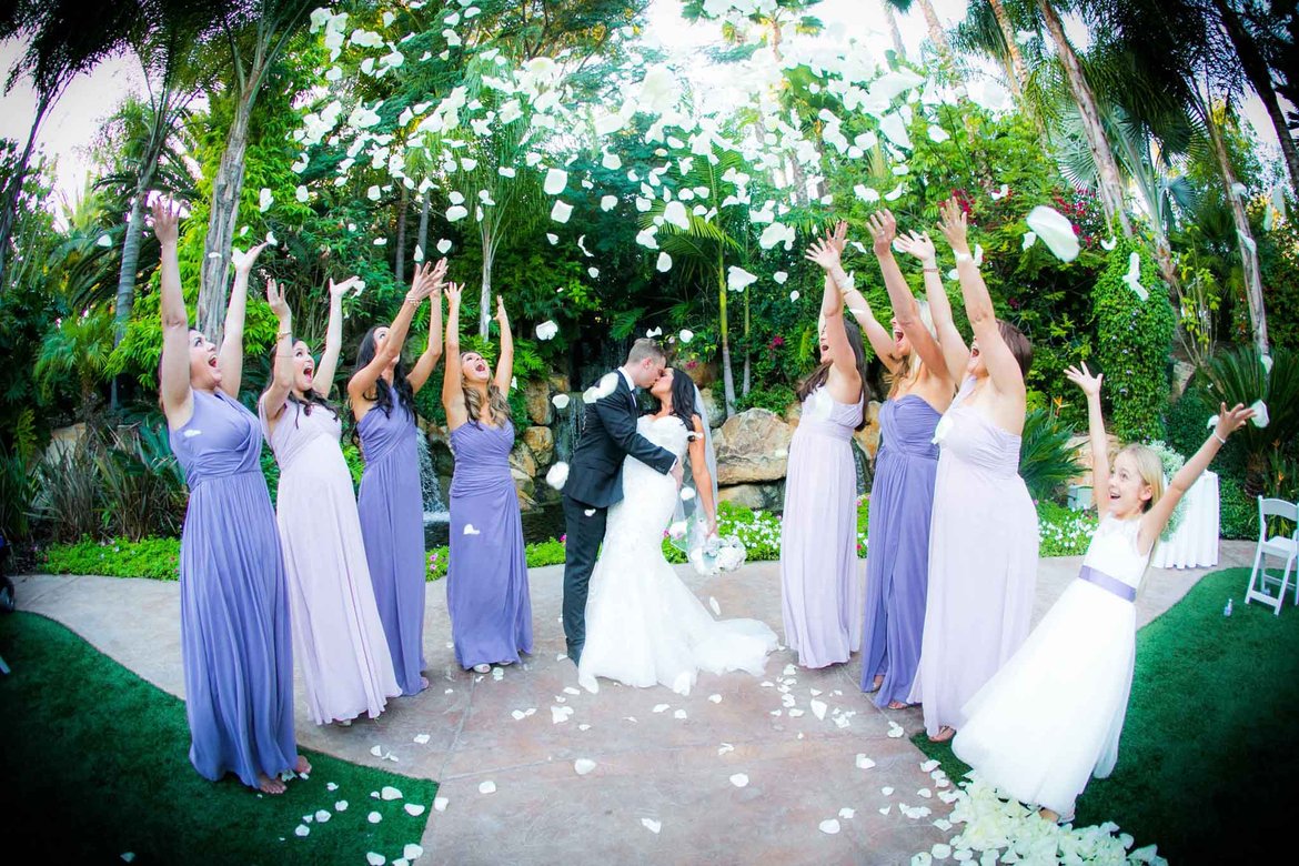 bridal party tossing flower petals