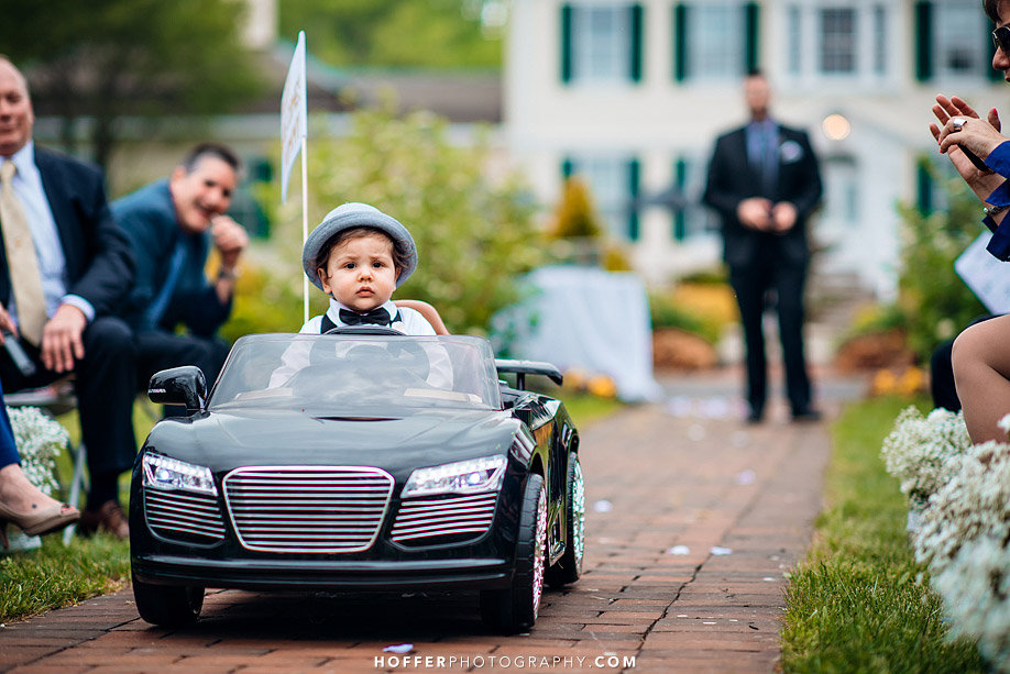 ring bearer driving down the aisle