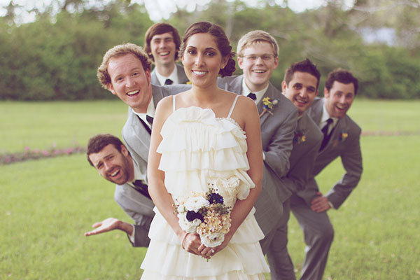 silly wedding photo with the groomsmen