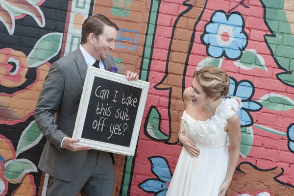 couple with chalkboard wedding photo