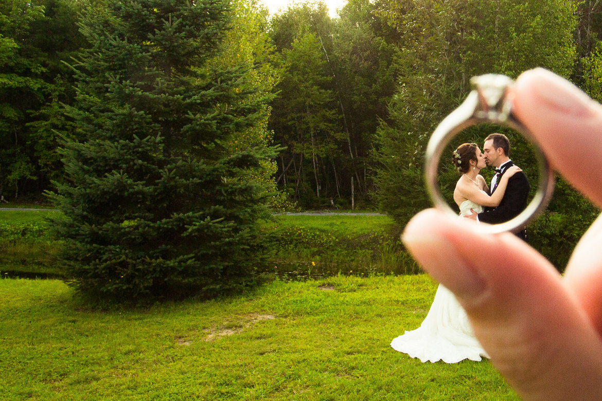 bride groom through engagement ring