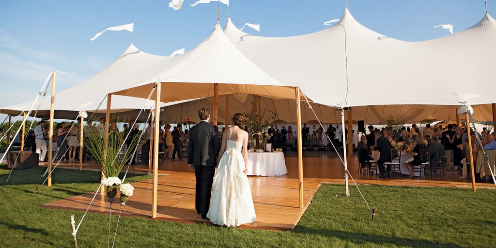 bride and groom in tent