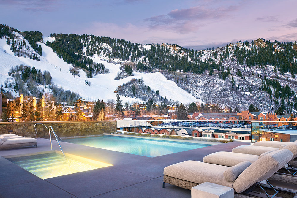 Aspen Colorado pool with snow covered mountains