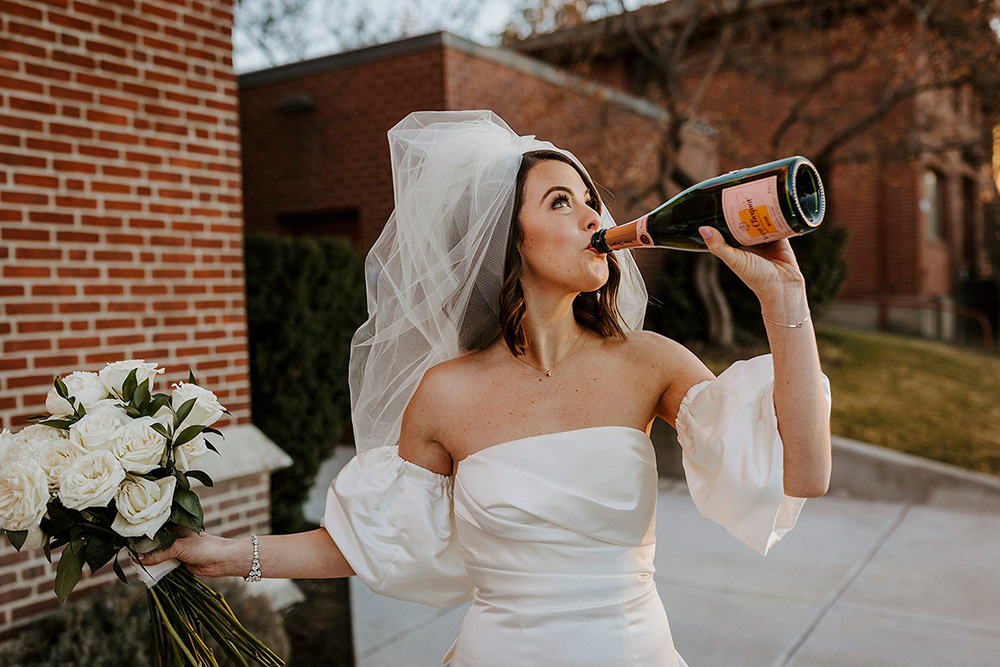 bride drinking champagne
