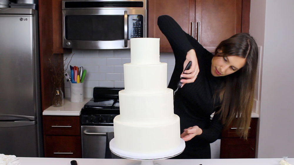 Woman Icing Wedding Cake
