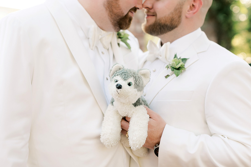 Couple with stuffed dog at wedding
