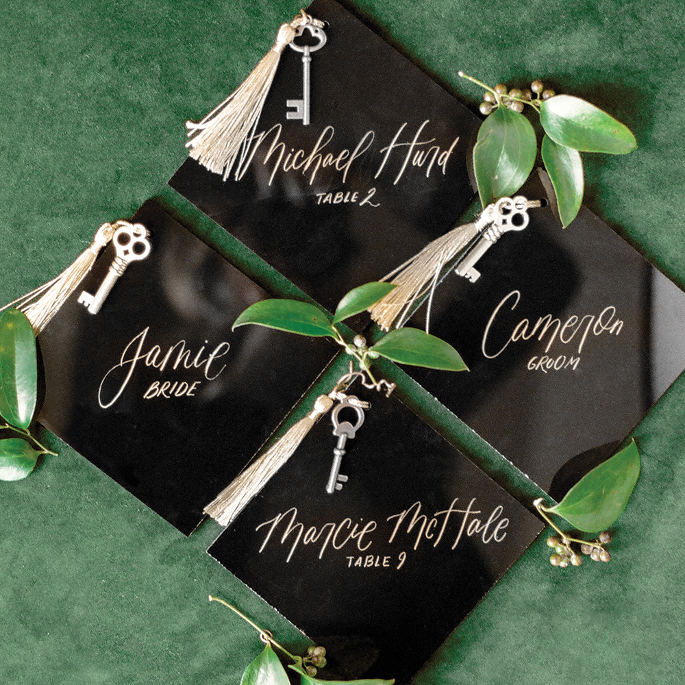 Black wedding escort cards with gold keys
