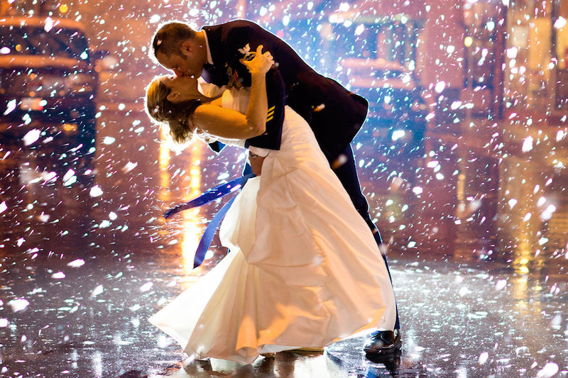 bride and groom kissing in the snow