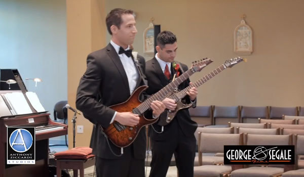groom playing guitar during wedding ceremony