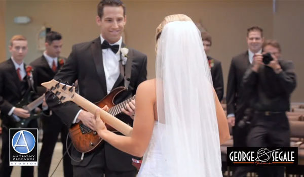 bride and groom playing guitar