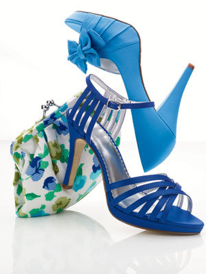 floral clutch and blue shoes