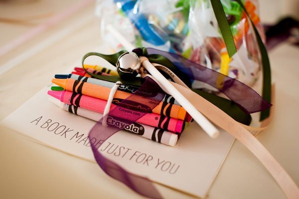 Pack a bag of goodies and have them distributed to all of the children in attendance (before the ceremony begins). 