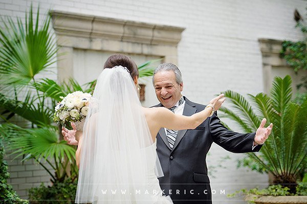 Set aside time for a "first look" with your father and ask your photographer to capture it on film.