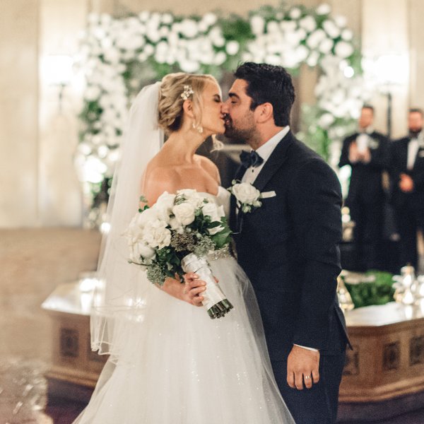 bride and groom first kiss