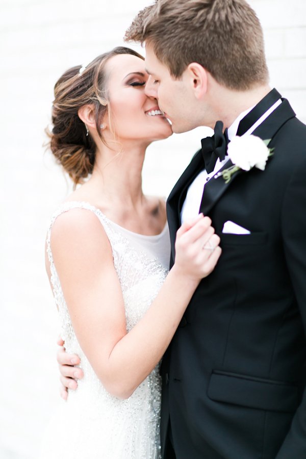 bride and groom kiss