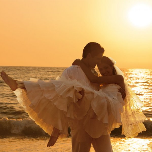 bride and groom on beach