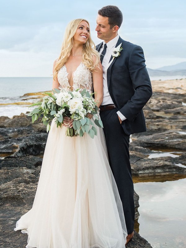 Bride and groom on beach