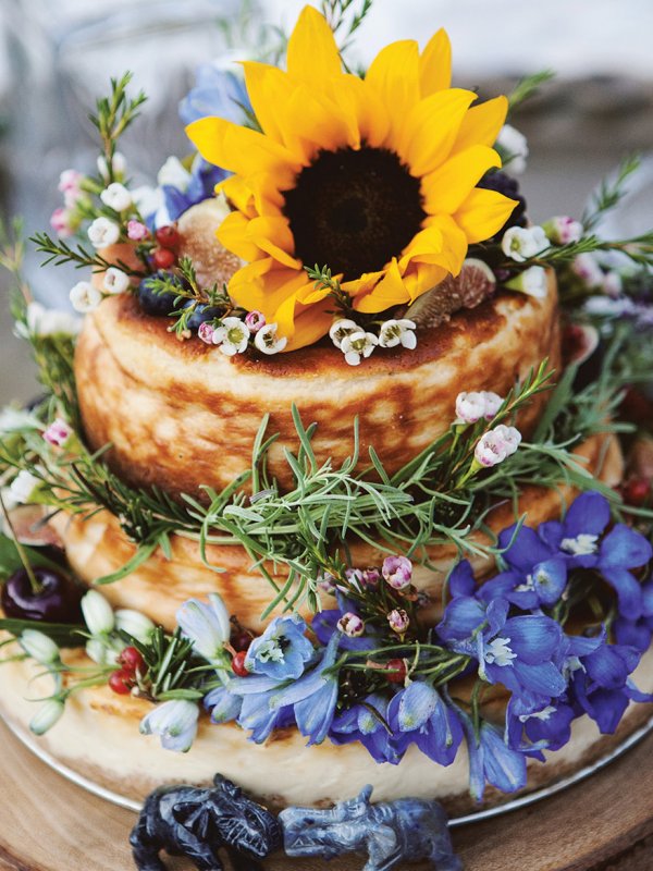 Cheesecake wedding cake with sunflower on top