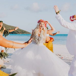 Bride and groom dancing on the beach