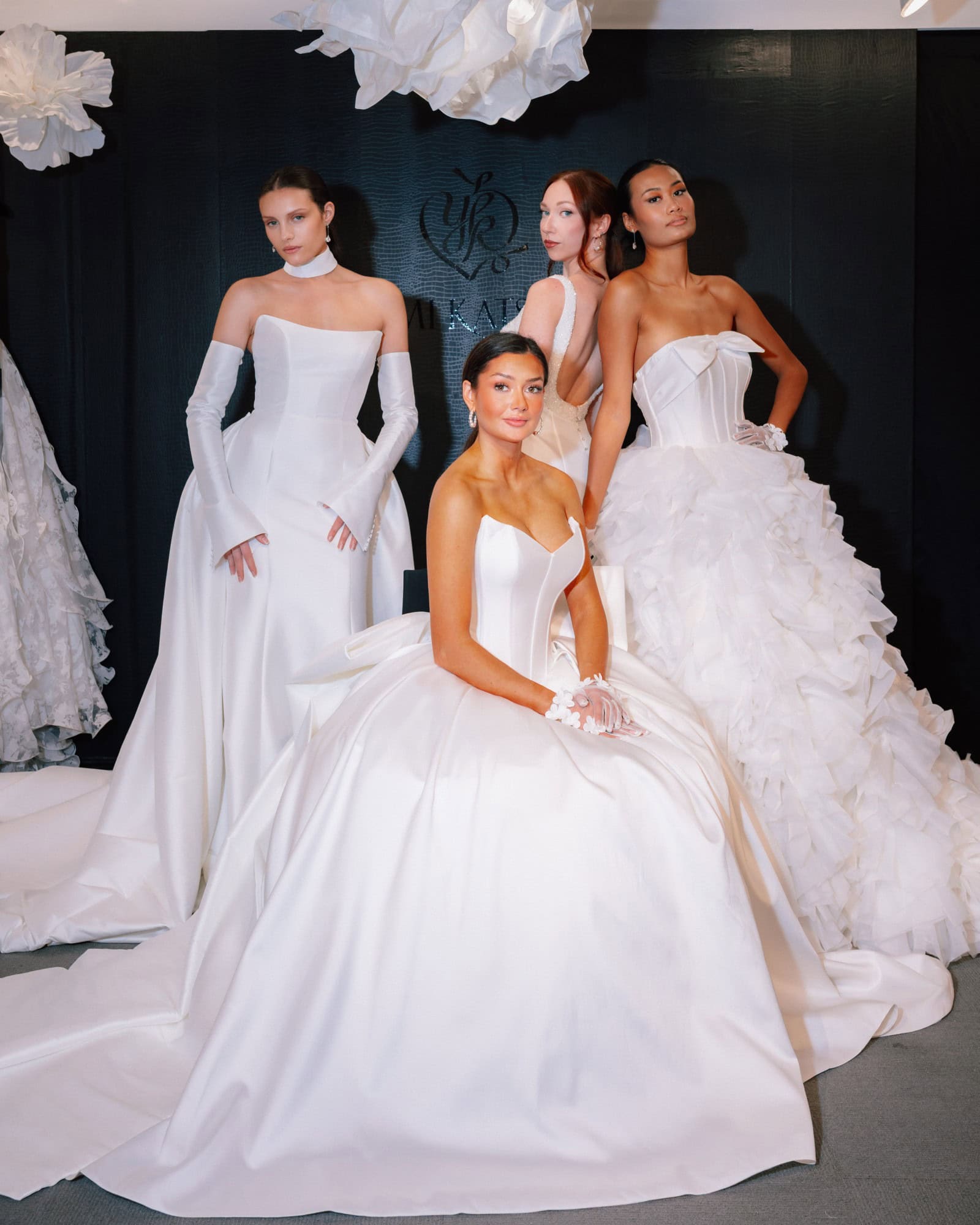 Elegant bridal gowns displayed at Bridal Guide wedding fashion showcase.