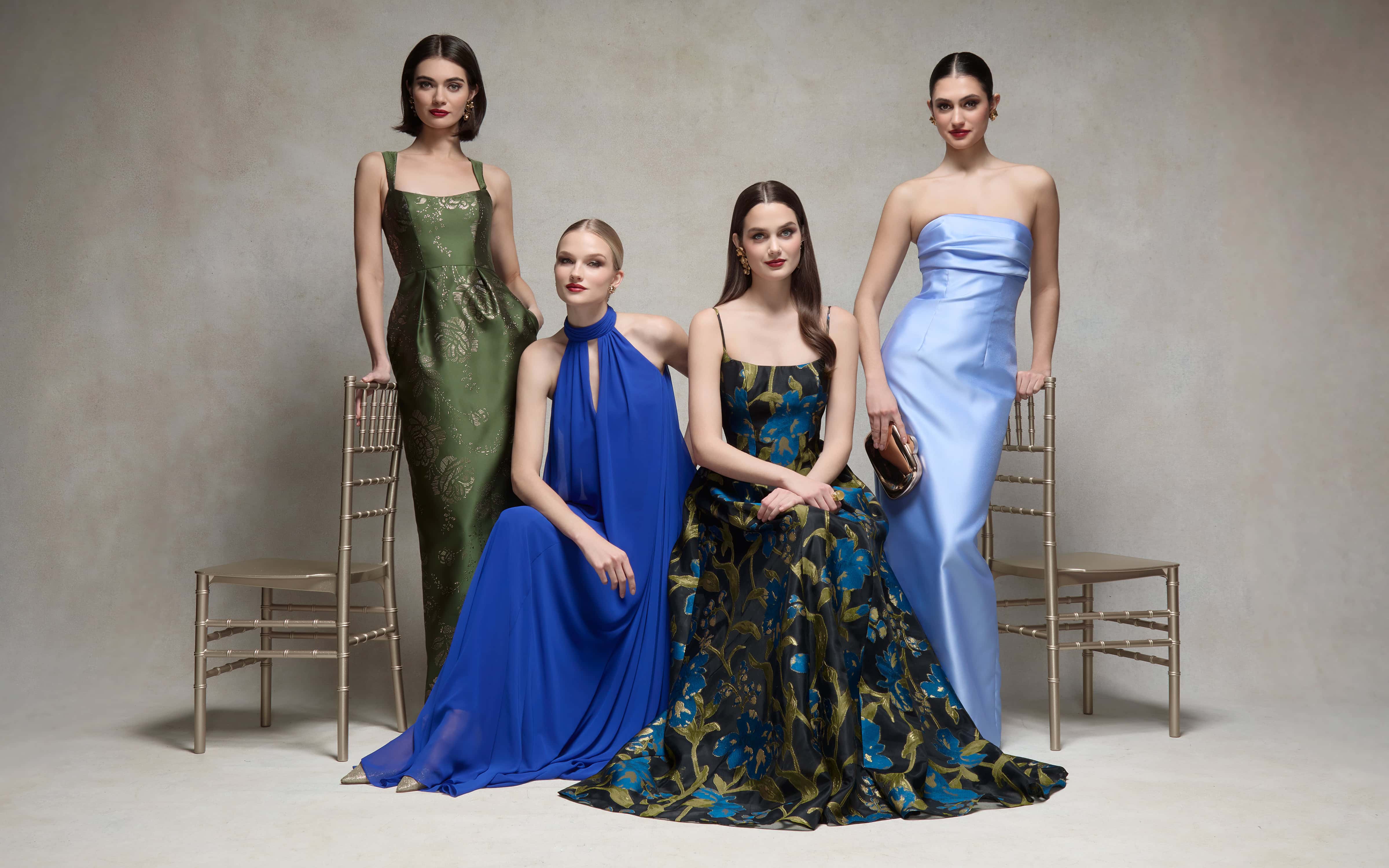 Bridesmaids in elegant blue and floral dresses for fall wedding trends.